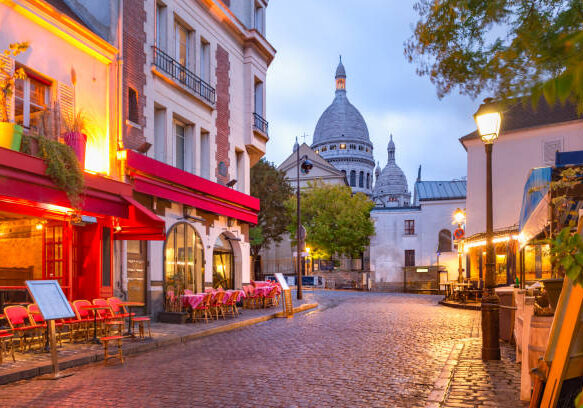 The Place du Tertre with tables of cafe and the Sacre-Coeur in the morning, quarter Montmartre in Paris, France